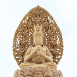 A statue of Dainichi Nyorai Buddha of the Shingon sect, made of camphor wood, surrounded by a halo of flying clouds, on an octagonal base.