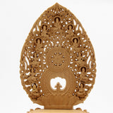 A statue of Dainichi Nyorai Buddha of the Shingon sect, made of camphor wood, surrounded by a halo of flying clouds, on an octagonal base.